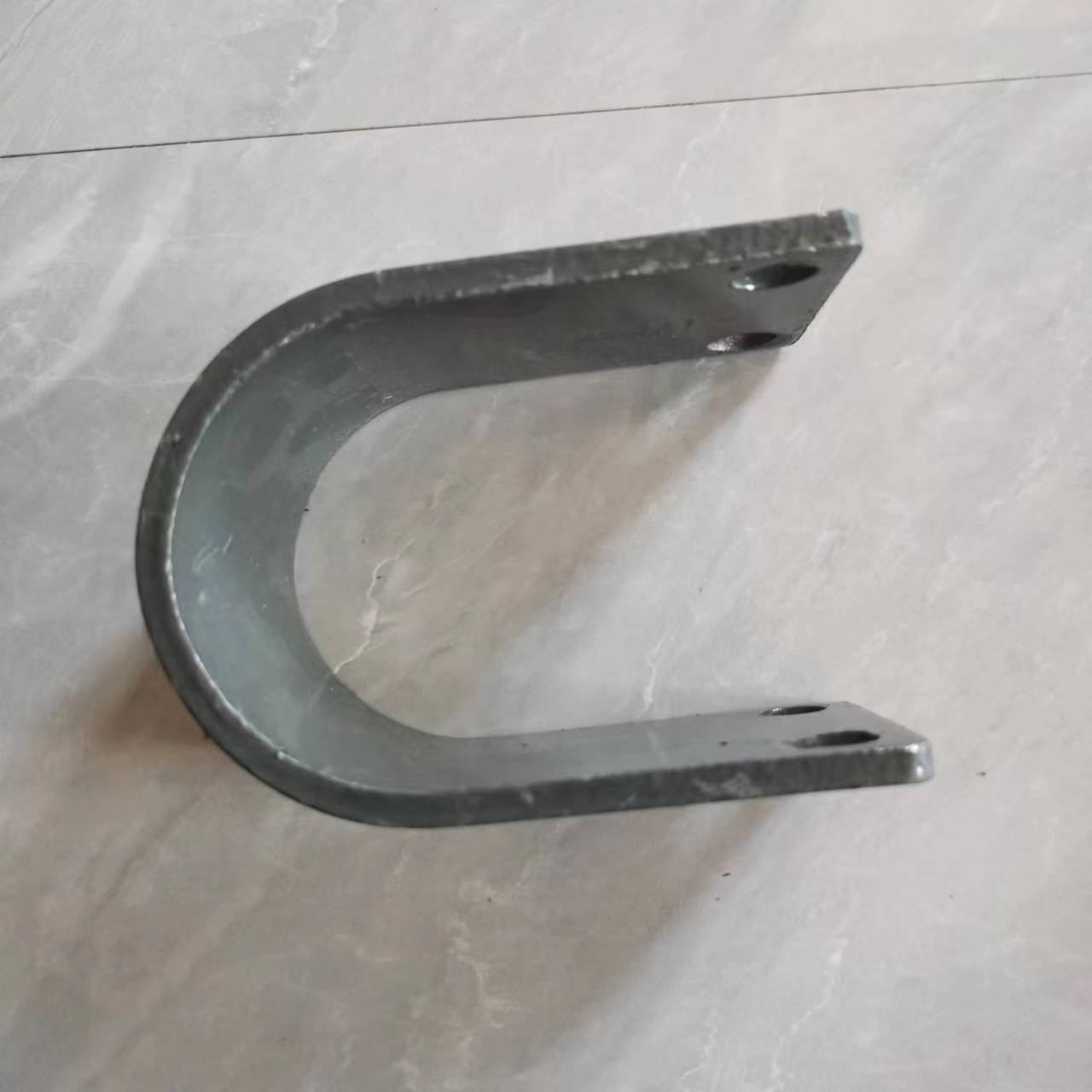 Rear stabilizer rod bearing clip, curved U bracket with fork ends, dark gray