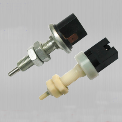 Stop light switch assembly with black housing, metal threaded stem, and spade terminals