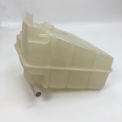 Plastic expansion tank assembly with side outlet opening and screw cap ports