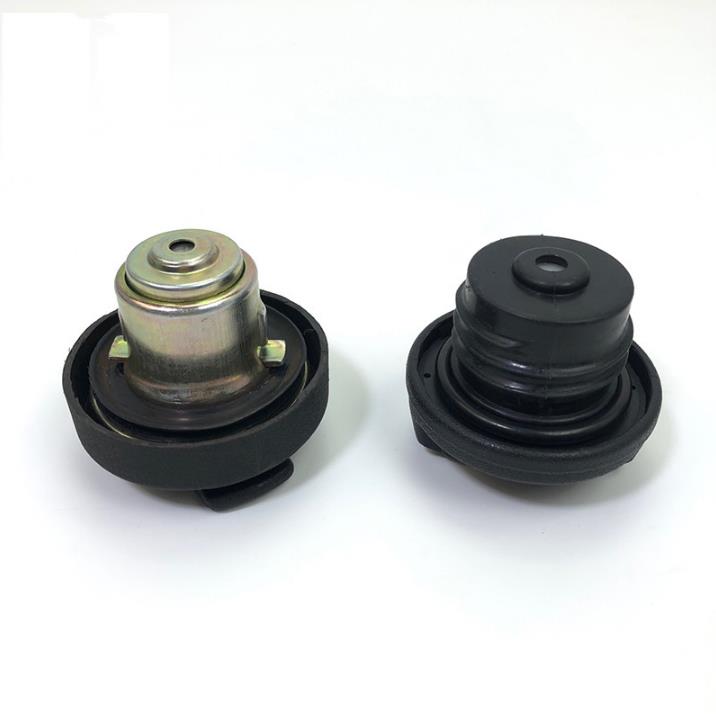 Fuel tank cap set with black rubber housing and metal center pin, two-piece design
