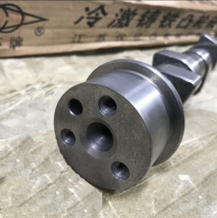 Camshaft assembly end cap with bolt holes and oil passage, metal shaft