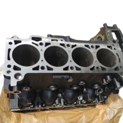 Engine cylinder block with four open cylinder bores and valve-side ports