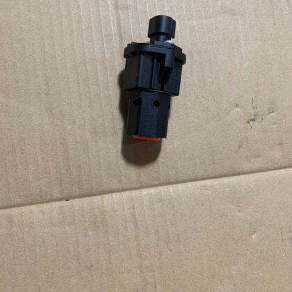 Push-button stop switch with red insert and black housing