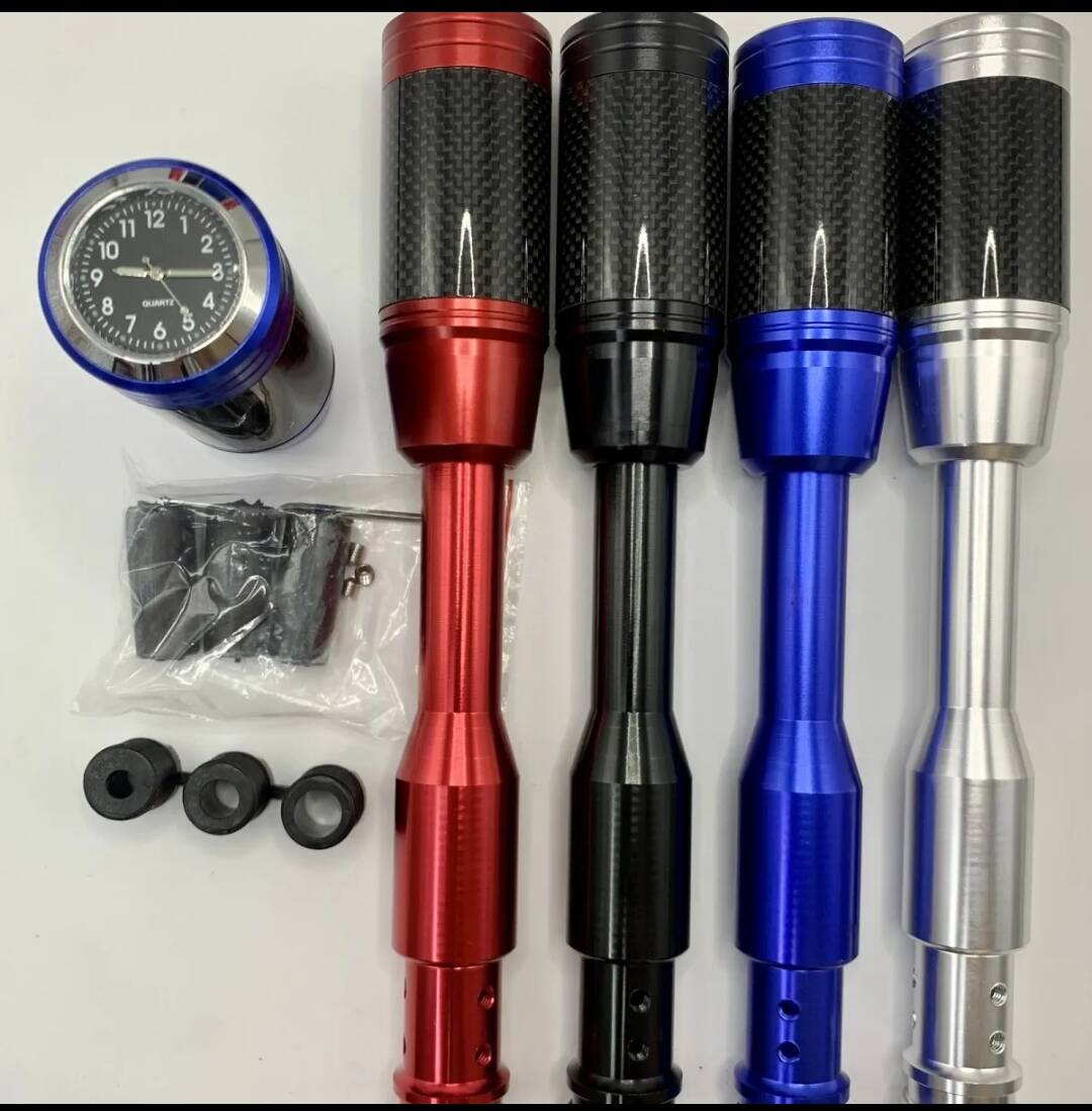Shift knob lengthener set with clock gauge; carbon-fiber sleeves in red, black, blue, silver