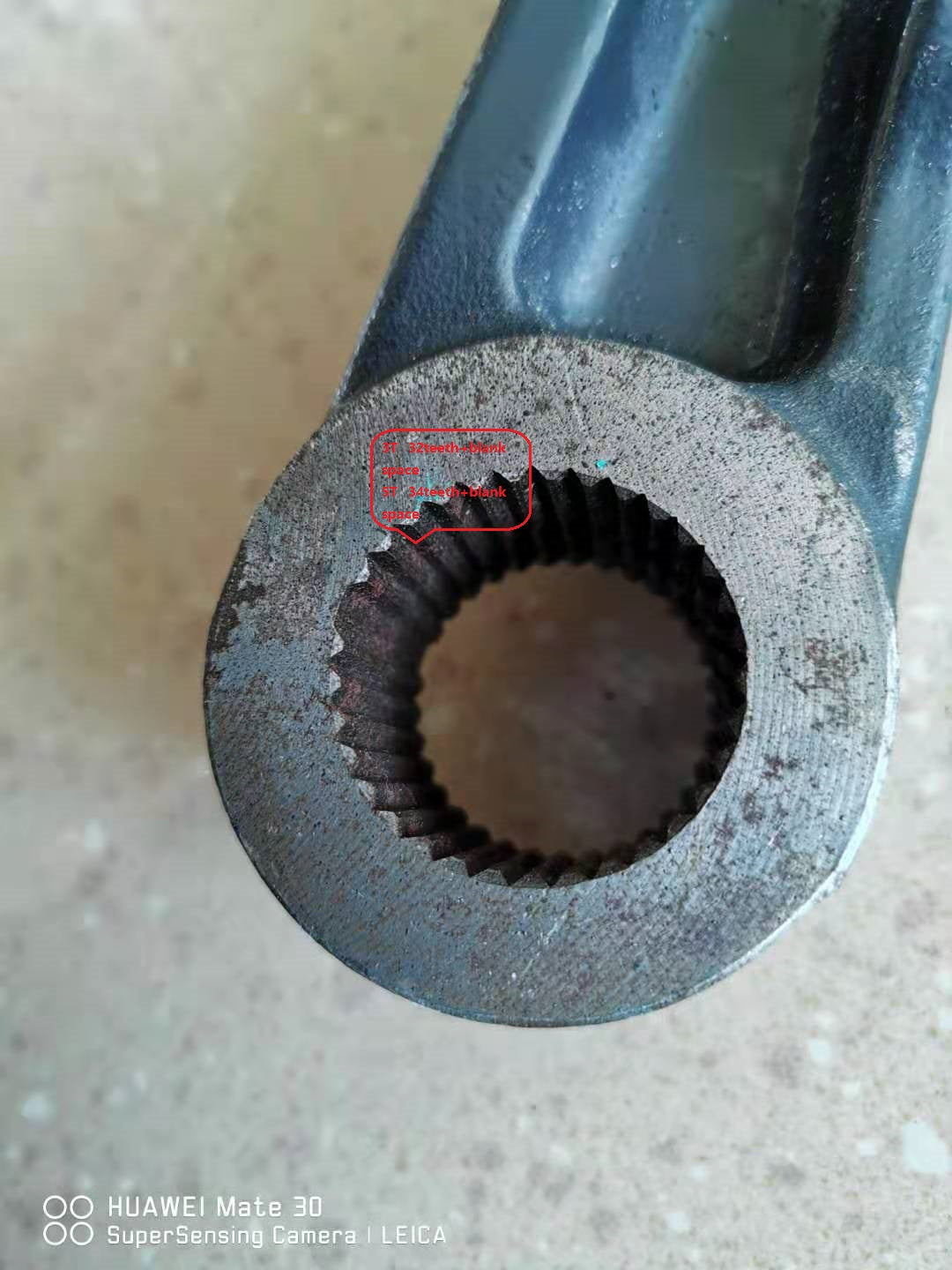 Swing arm fork bushing seat with internal serrations, blue-black steel