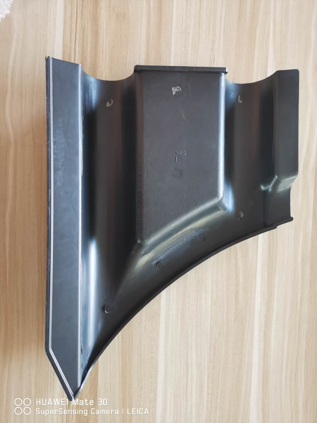 Front bumper plastic sheet, dark gray inner mounting side with curved shape