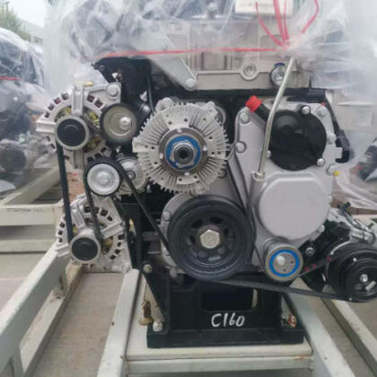 Engine accessory drive assembly with multiple pulleys and a black belt tension area
