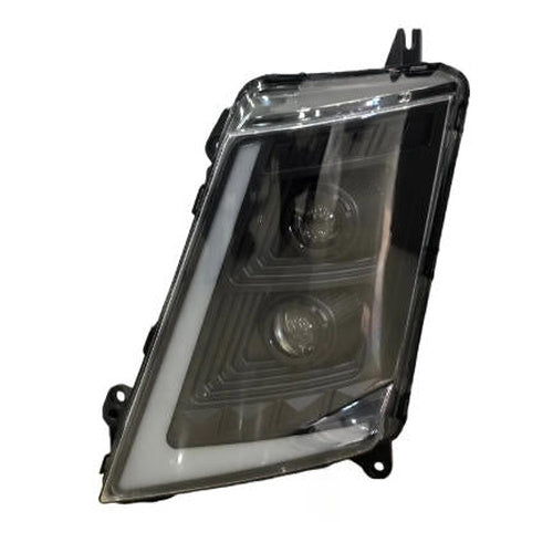 LED headlight assembly with clear lens and black housing, front view, mounting tabs