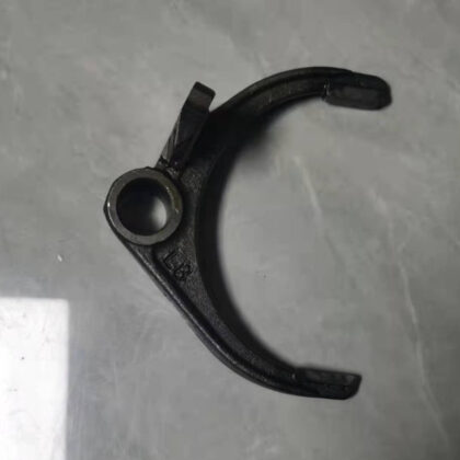 Black shift fork with round bushing hole and one straight mounting tab