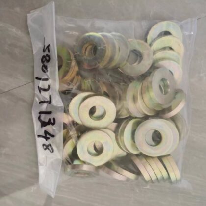 Set of round spacer shims with center holes, shown in a clear plastic bag