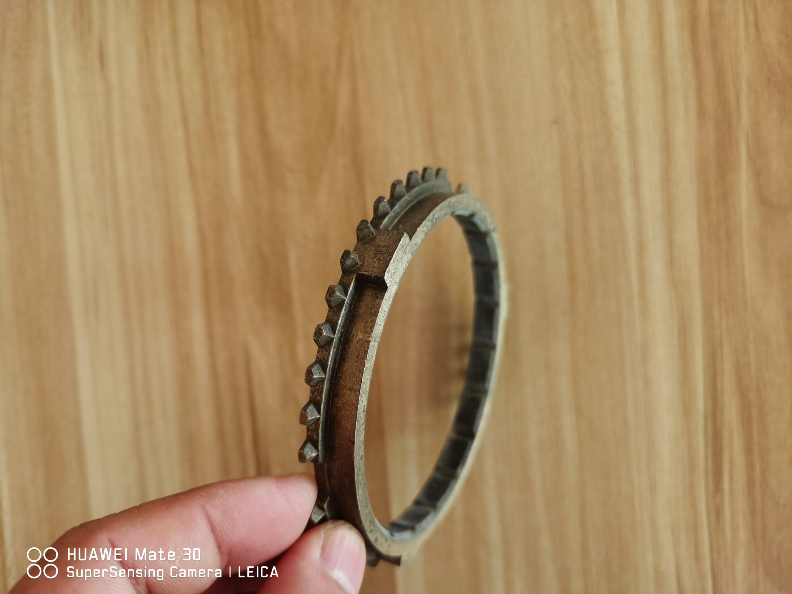 Synchronizer ring gear with outer gear teeth, hand-held close view