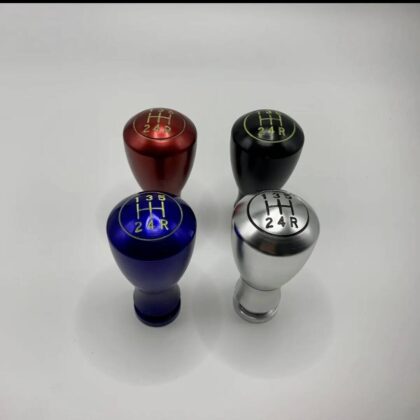 Set of 5-speed shift knobs in red, black, blue, and silver with gear numbers
