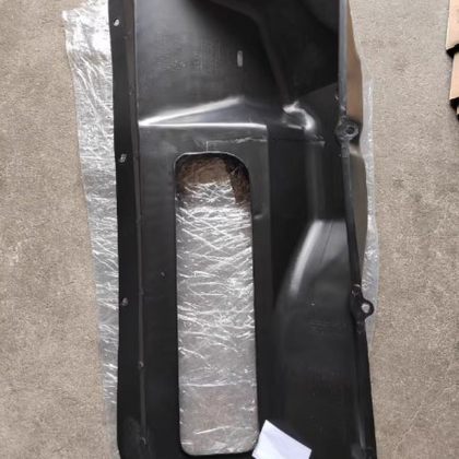 Black engine hood intake chamber panel with rectangular air opening and mounting holes