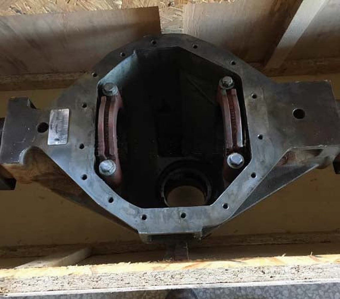 Rear axle housing with circular opening, cover, and side mounting brackets