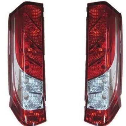 Pair of rear tail lights with red and clear lenses in dark housings