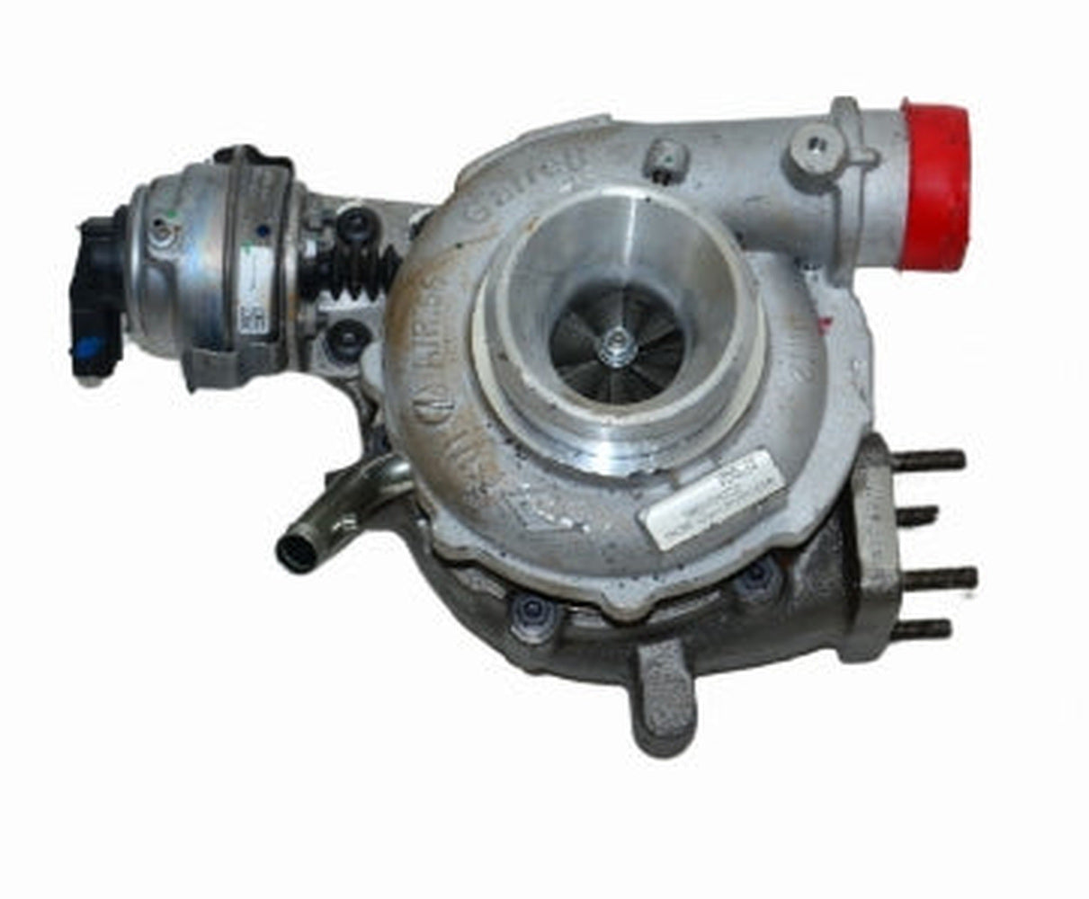 Turbocharger with silver body, visible turbine, and red cap outlet